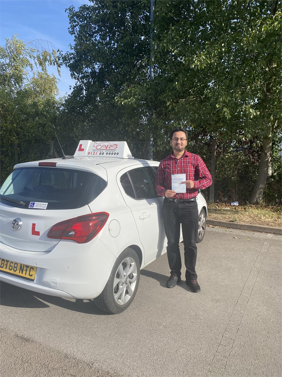 Cars Driving School student celebrating a practical driving test pass
