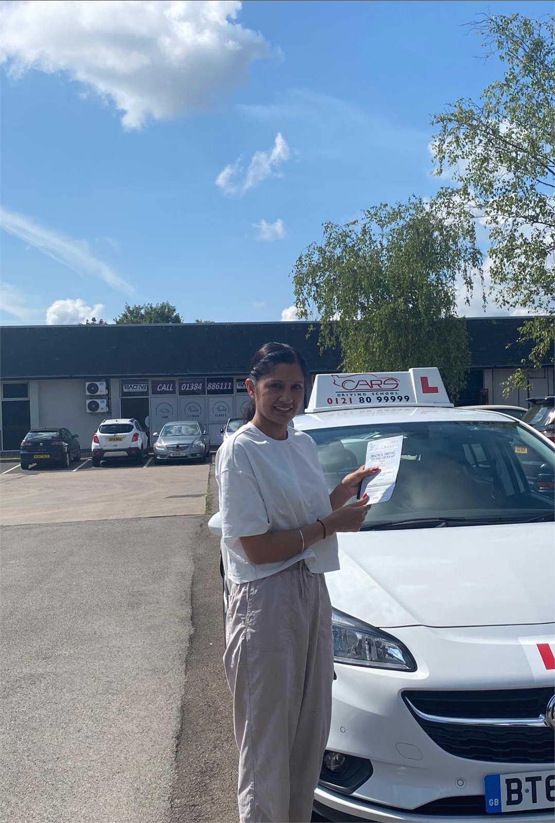Cars Driving School student celebrating a practical driving test pass