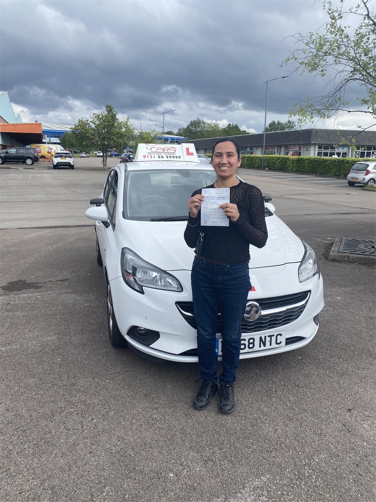 Cars Driving School student celebrating a practical driving test pass