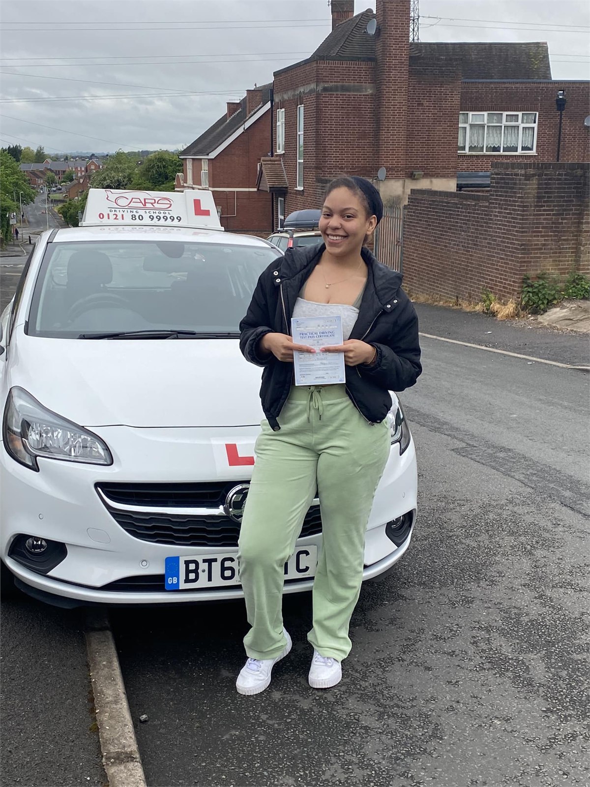 Cars Driving School student celebrating a practical driving test pass
