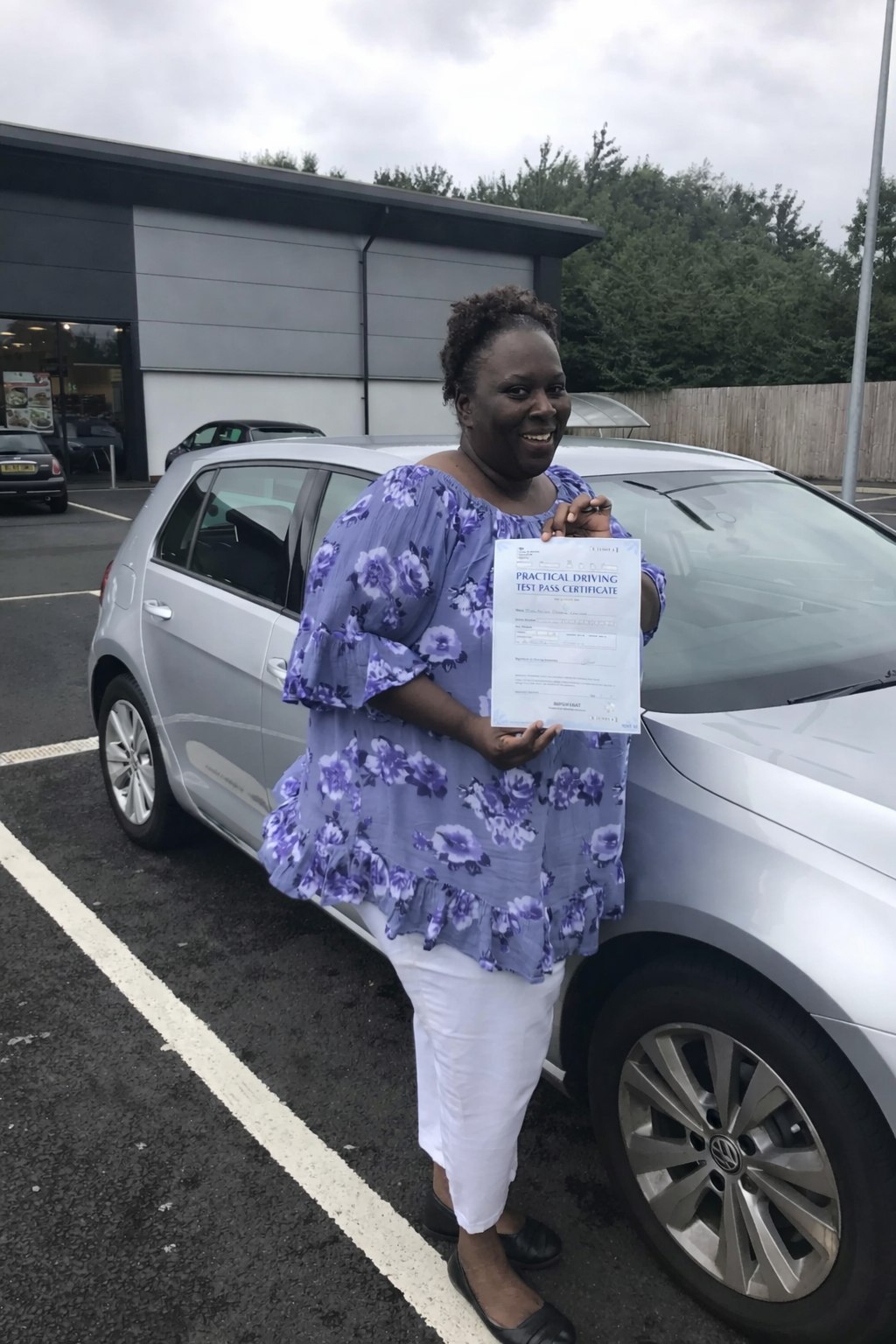 Cars Driving School student celebrating a practical driving test pass