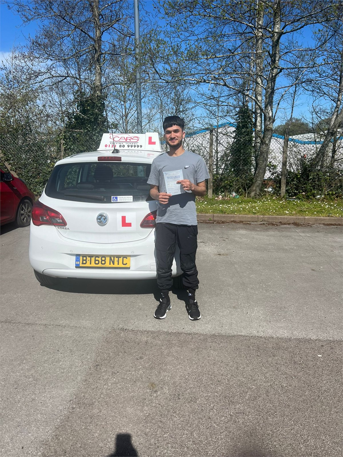 Cars Driving School student celebrating a practical driving test pass